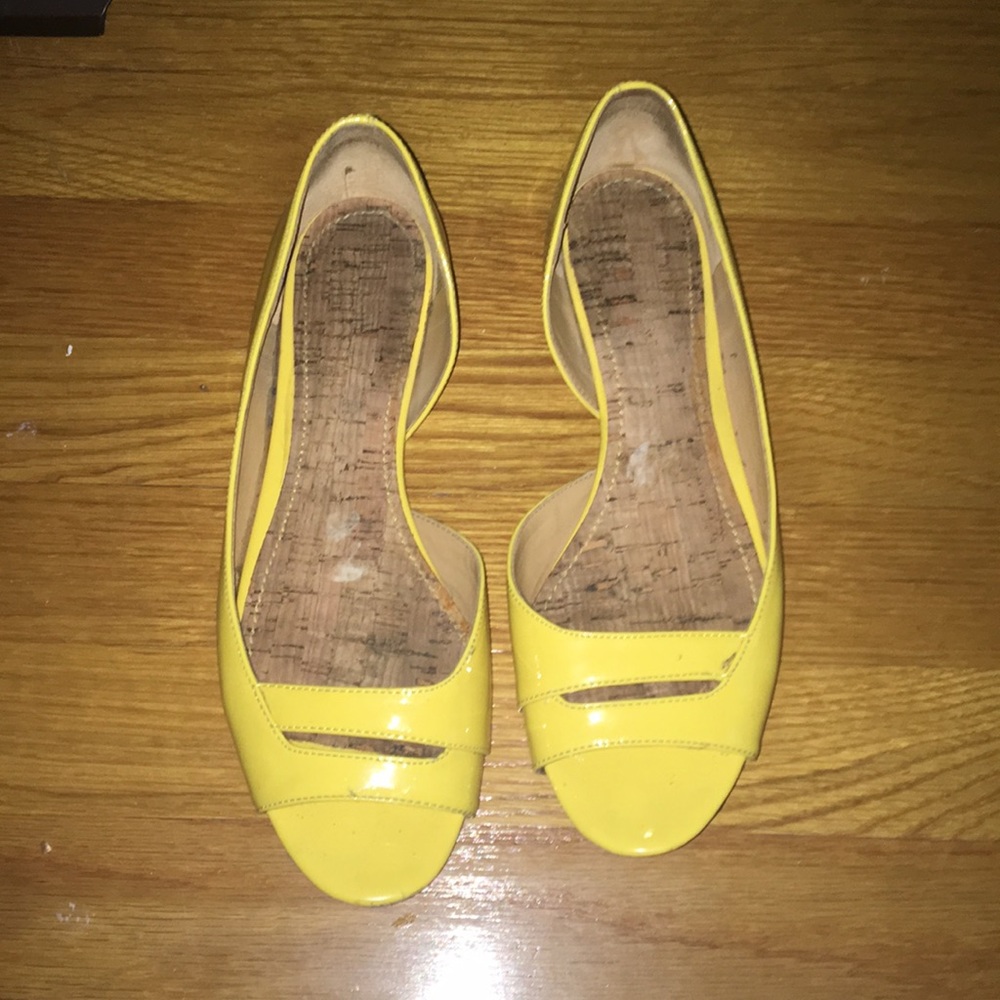 Bright yellow Nine West flats